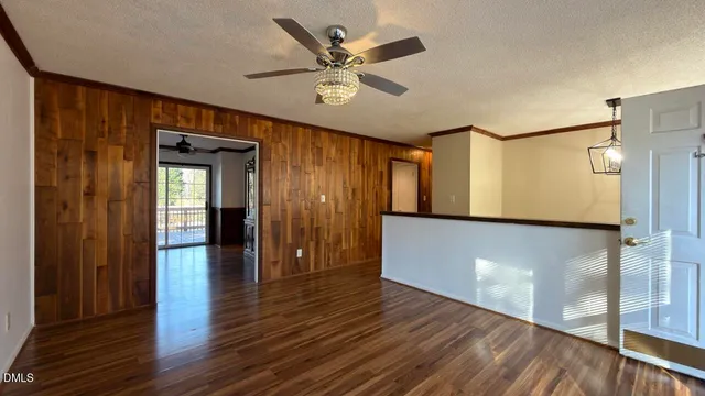 a view of an entryway with wooden floor