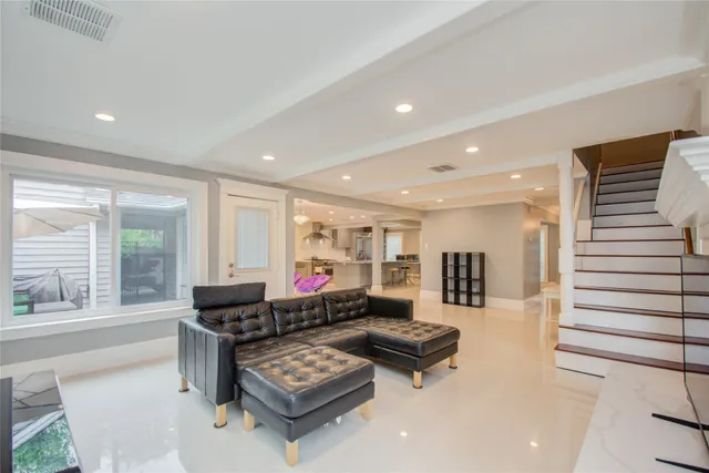 a living room with fireplace furniture and a window