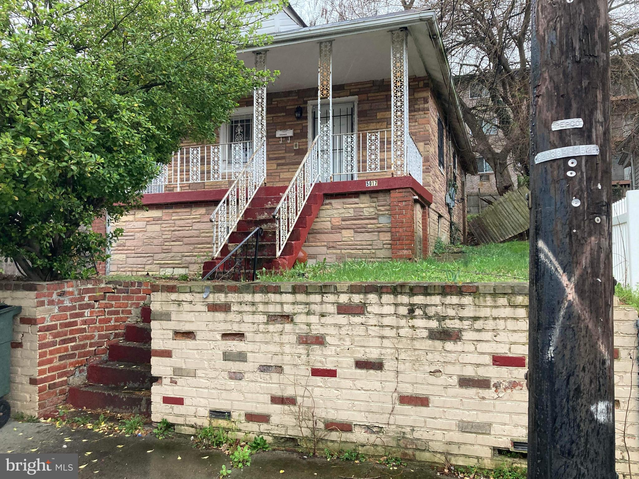 5017 Ayers Place Southeast Washington, DC 20019 - Photo 1 of 1 a front view of a house with a yard