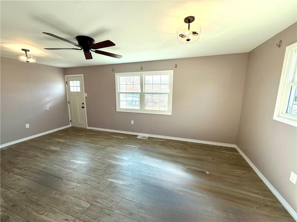 2118 Brodhead Road Aliquippa, PA 15001 - Photo 15 of 35 a view of an empty room with wooden floor and a window