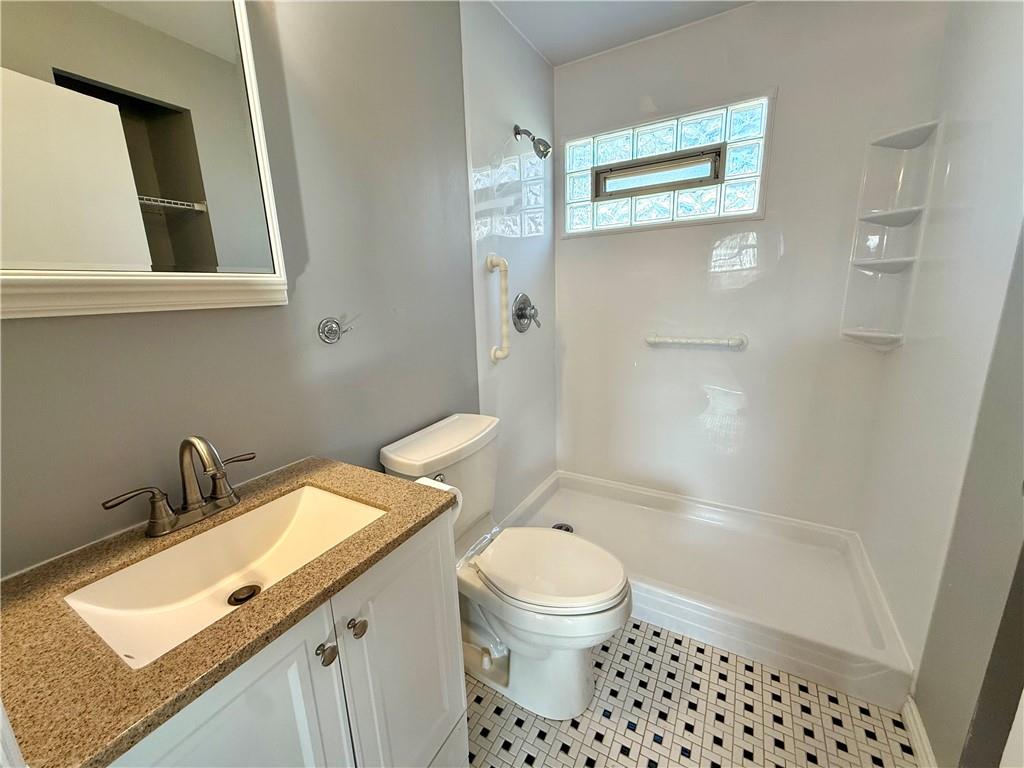 2118 Brodhead Road Aliquippa, PA 15001 - Photo 16 of 35 a bathroom with a granite countertop sink toilet and shower