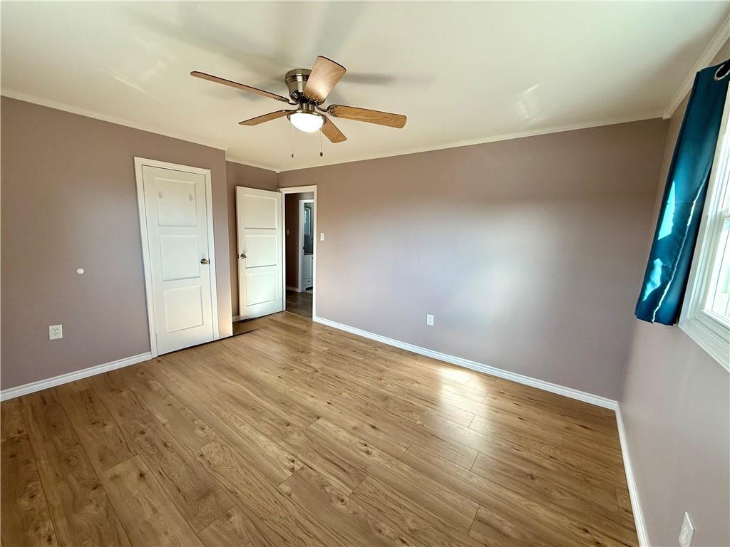 2118 Brodhead Road Aliquippa, PA 15001 - Photo 20 of 35 a view of empty room with wooden floor and fan
