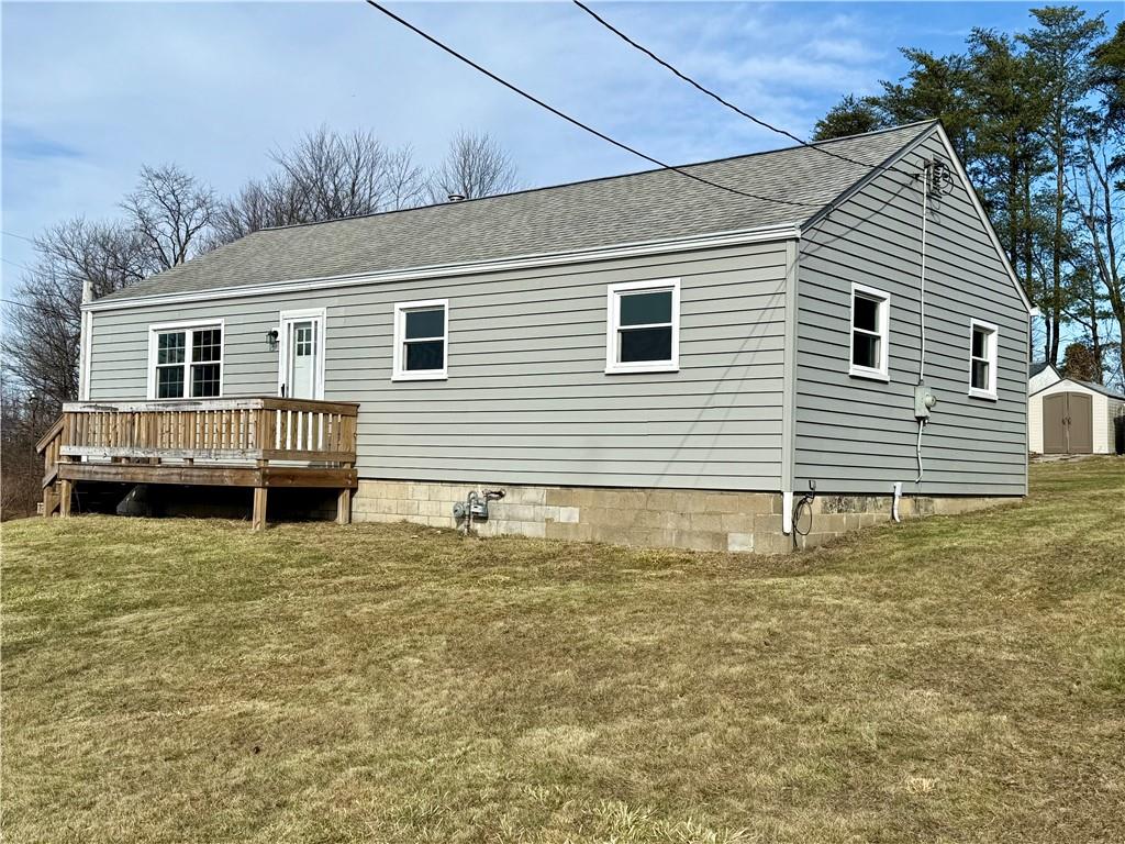 2118 Brodhead Road Aliquippa, PA 15001 - Photo 2 of 35 a view of a house with a yard and sitting area