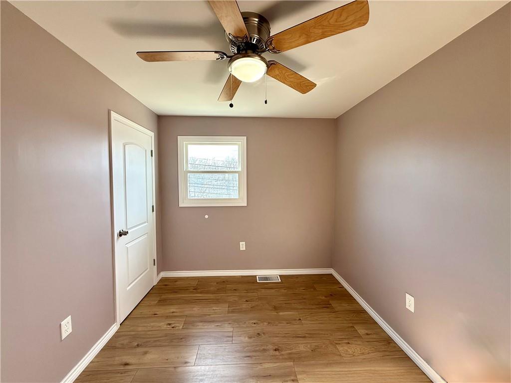 2118 Brodhead Road Aliquippa, PA 15001 - Photo 23 of 35 wooden floor in an empty room with a window