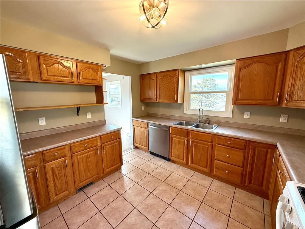 2118 Brodhead Road Aliquippa, PA 15001 - Photo 4 of 35 a kitchen with stainless steel appliances granite countertop a sink and cabinets