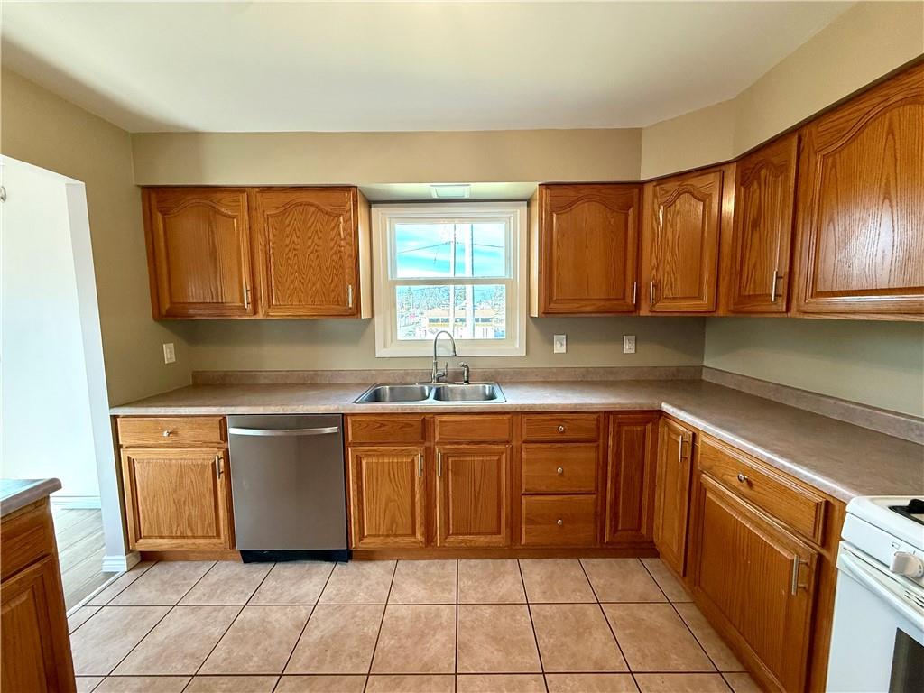 2118 Brodhead Road Aliquippa, PA 15001 - Photo 5 of 35 a kitchen with a sink cabinets and window