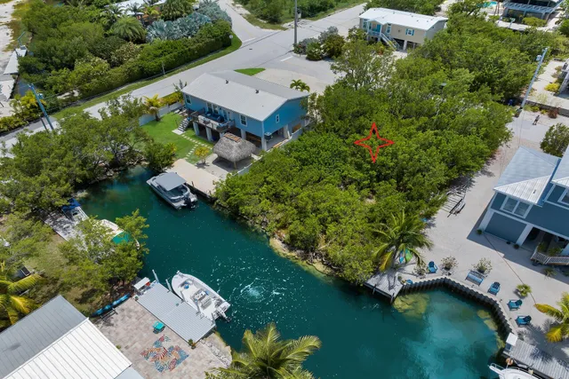 an aerial view of a house with a garden space
