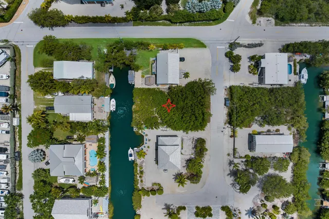 an aerial view of a house with outdoor space
