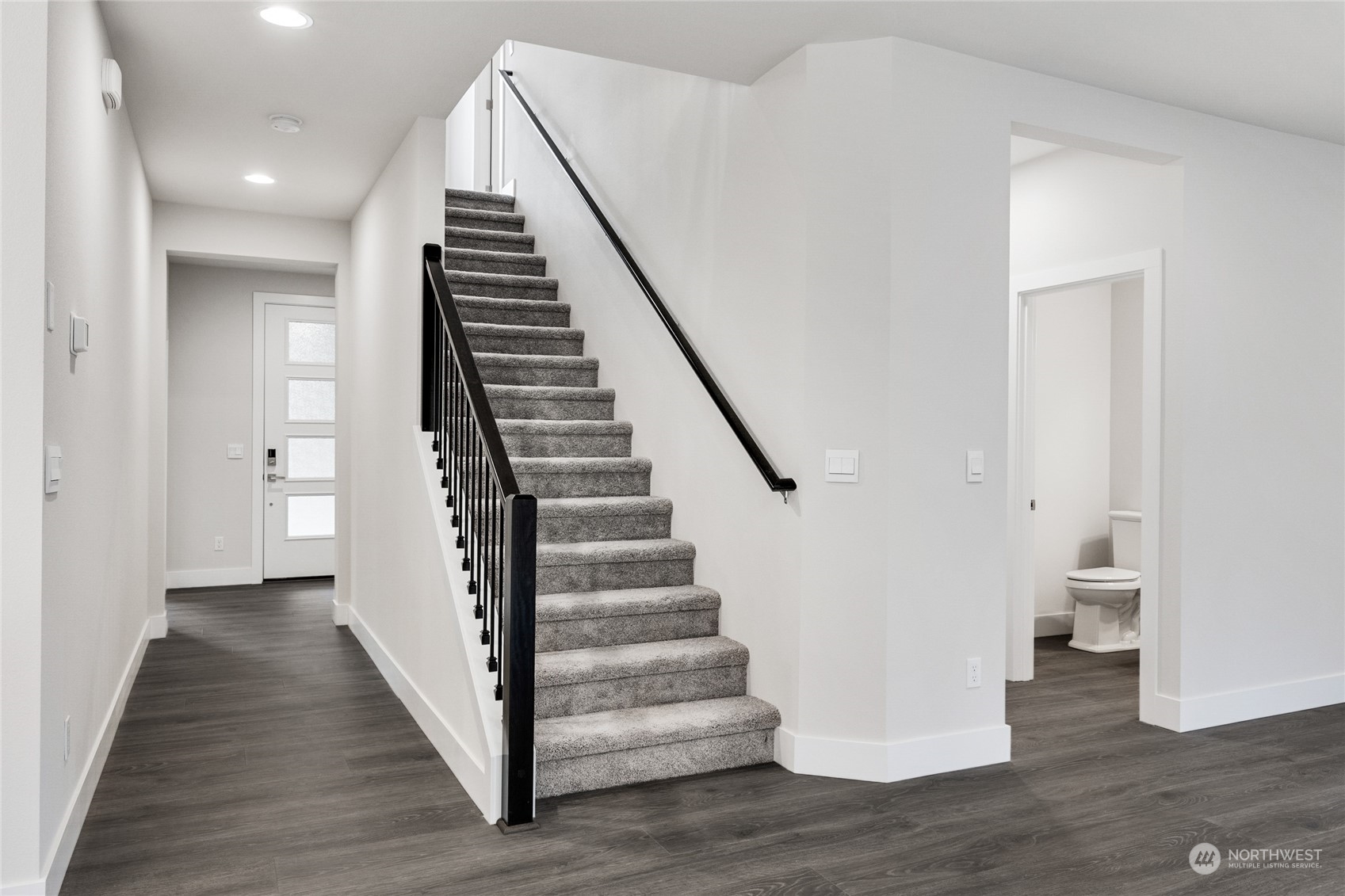 4 178th Place Southwest Bothell, WA 98012 - Photo 11 of 34 a view of a hallway with wooden floor and entryway