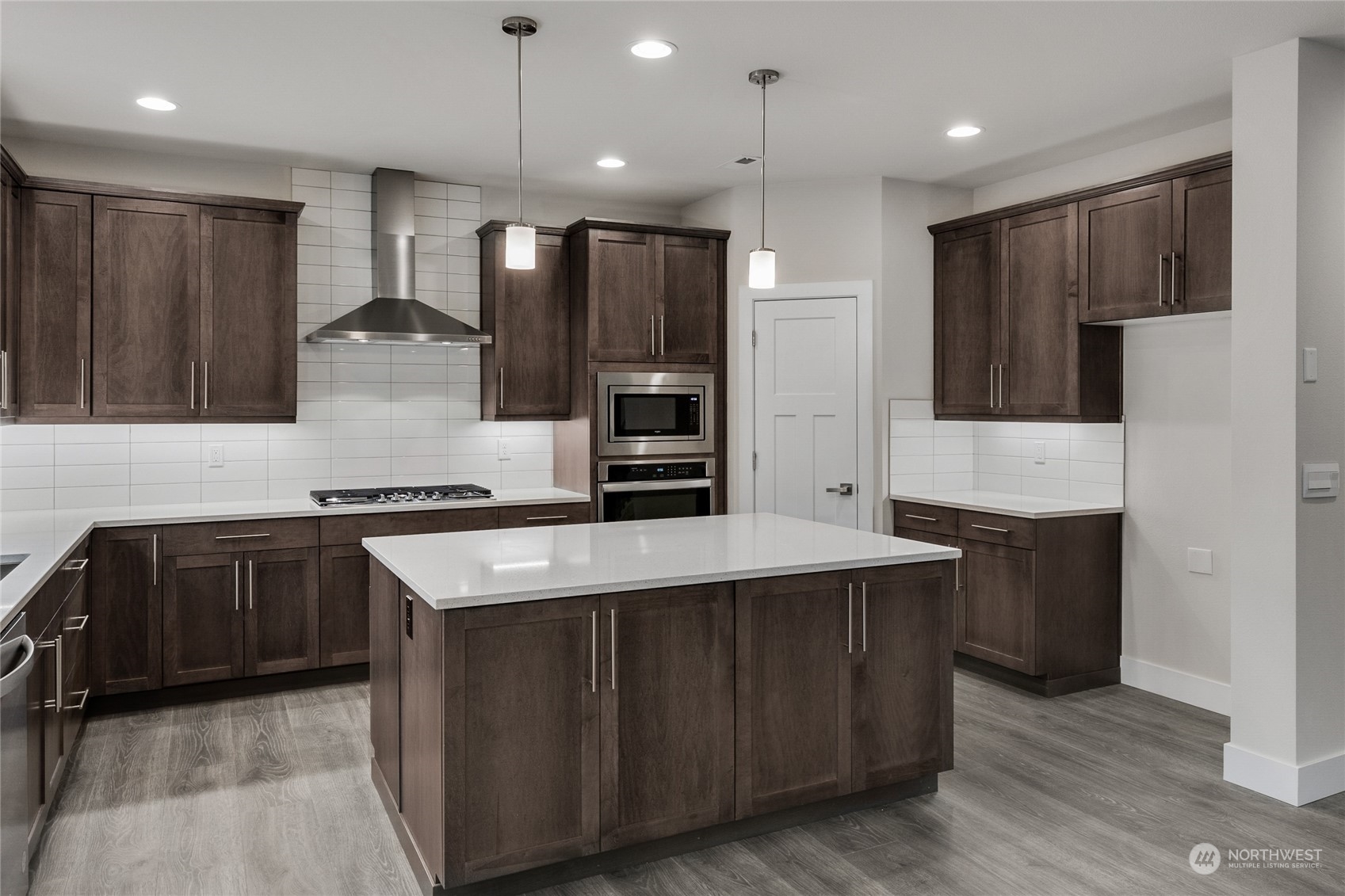4 178th Place Southwest Bothell, WA 98012 - Photo 16 of 34 a kitchen with stainless steel appliances granite countertop wooden cabinets a refrigerator and a stove