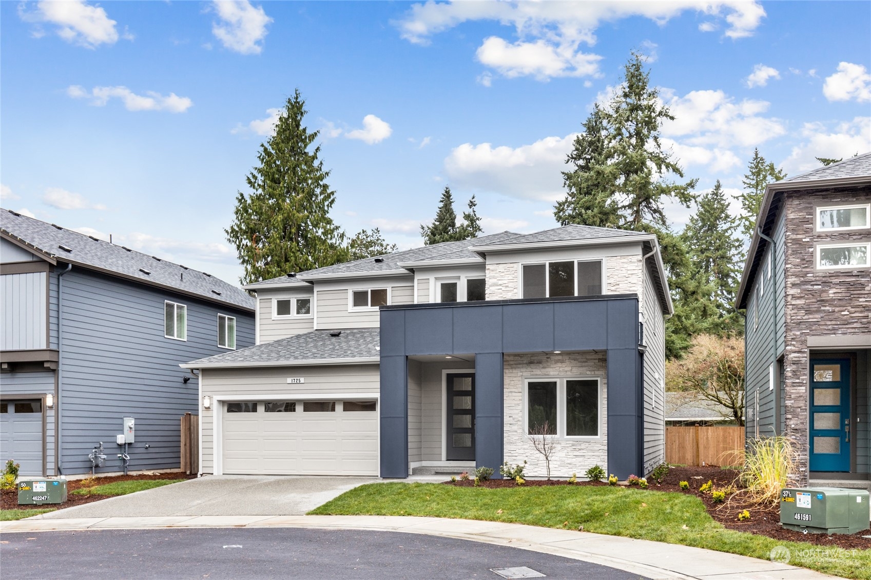 4 178th Place Southwest Bothell, WA 98012 - Photo 32 of 34 a view of a white house with a small yard and large tree