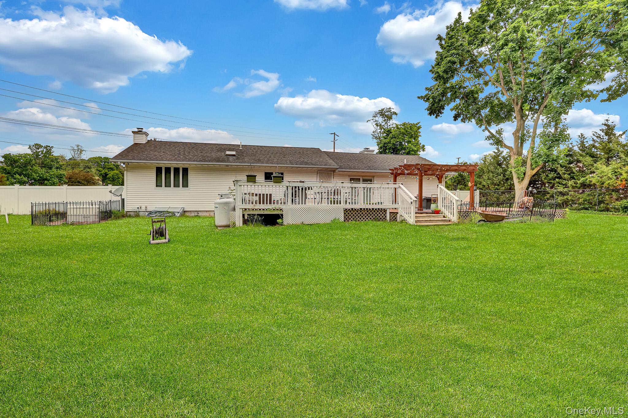98 Granny Road Farmingville, NY 11738 - Photo 23 of 24 a view of a house with a yard and sitting area