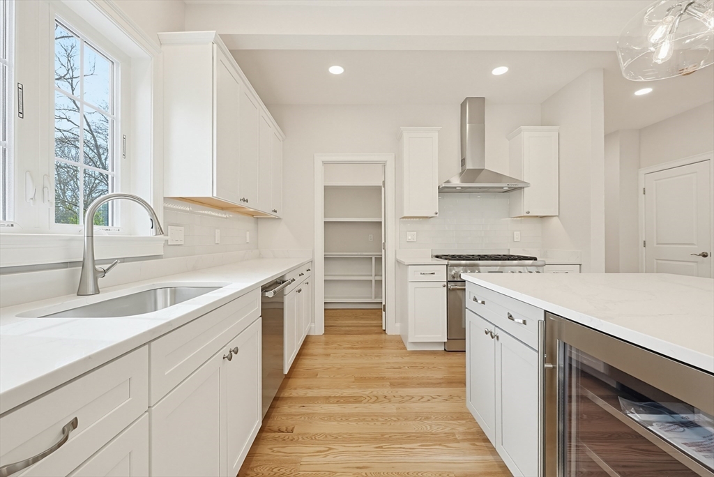 889 Maple Street Mansfield, MA 02048 - Photo 18 of 42 a kitchen with kitchen island a sink stainless steel appliances and cabinets