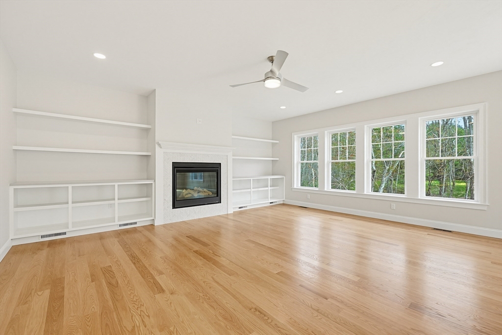 889 Maple Street Mansfield, MA 02048 - Photo 20 of 42 a view of an empty room with a window and wooden floor