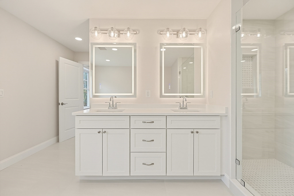 889 Maple Street Mansfield, MA 02048 - Photo 25 of 42 a bathroom with a double vanity sink mirror and