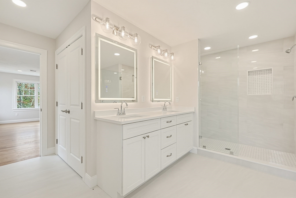 889 Maple Street Mansfield, MA 02048 - Photo 29 of 42 a bathroom with a double vanity sink mirror and shower