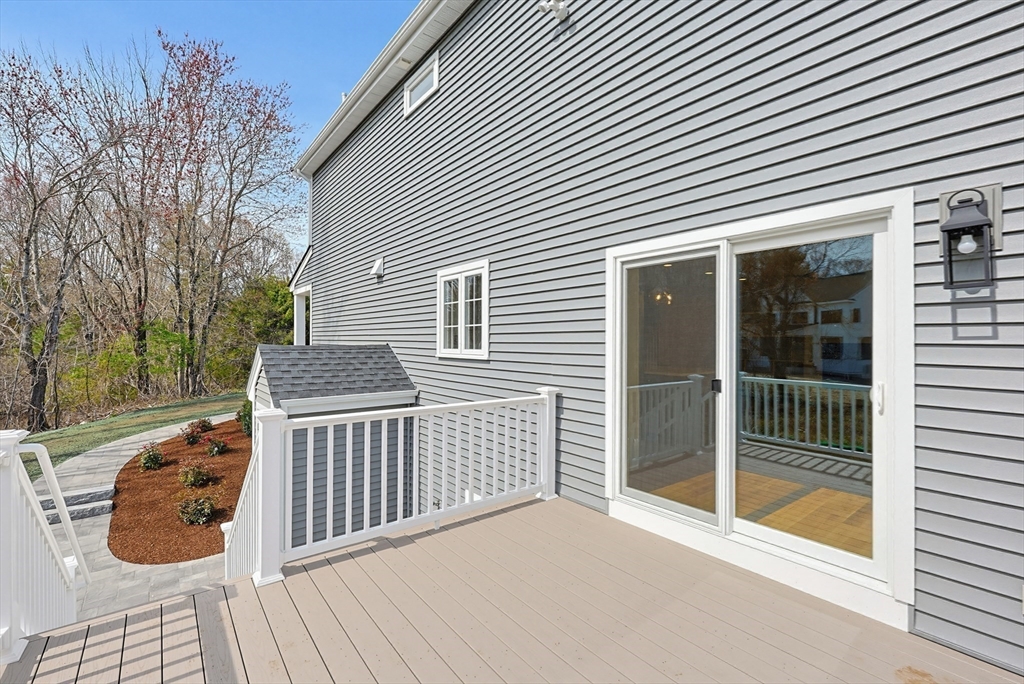 889 Maple Street Mansfield, MA 02048 - Photo 38 of 42 a view of backyard with barbeque grill and floor to ceiling window