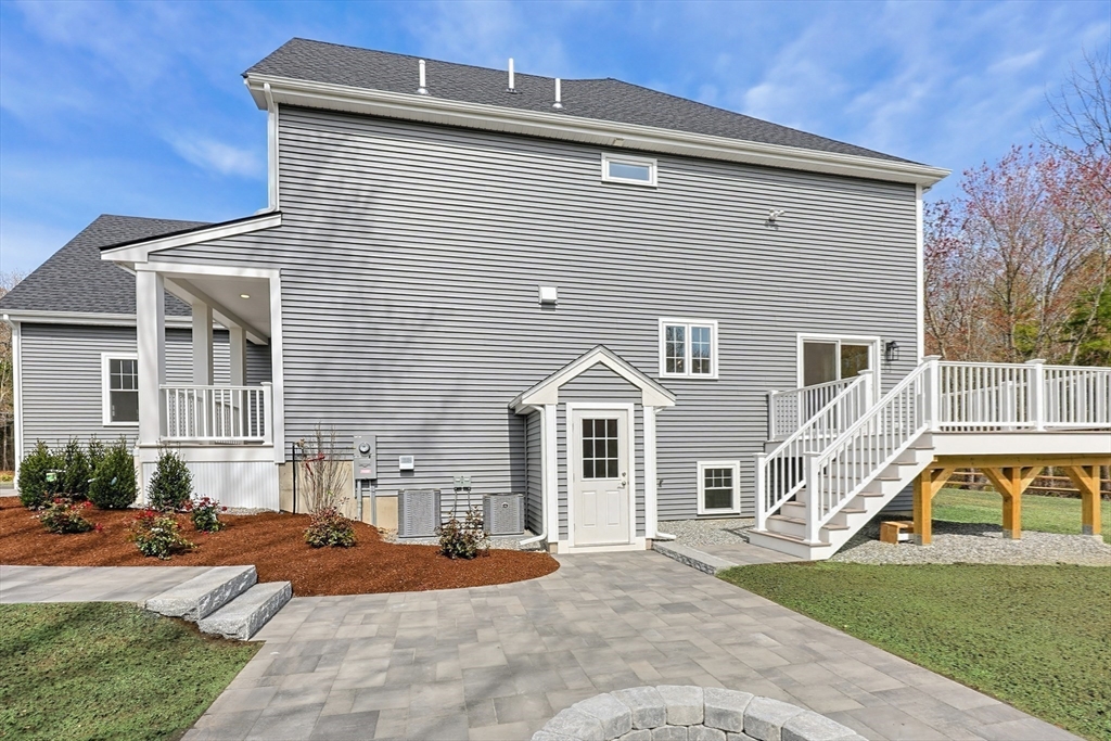889 Maple Street Mansfield, MA 02048 - Photo 39 of 42 a front view of a house with a yard