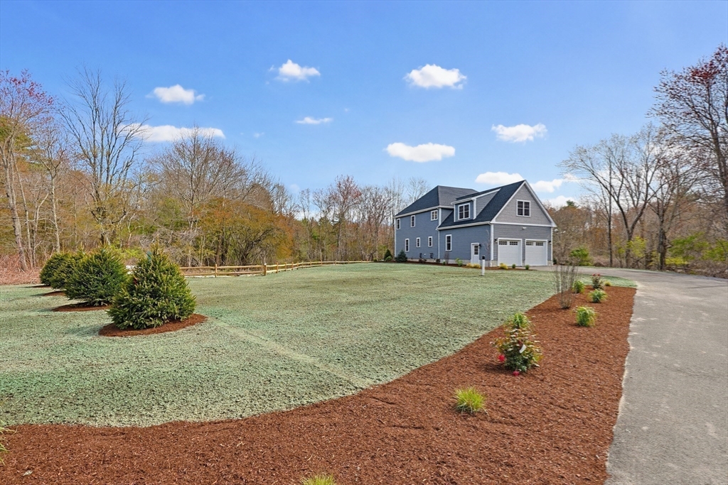 889 Maple Street Mansfield, MA 02048 - Photo 42 of 42 a view of a house with a yard
