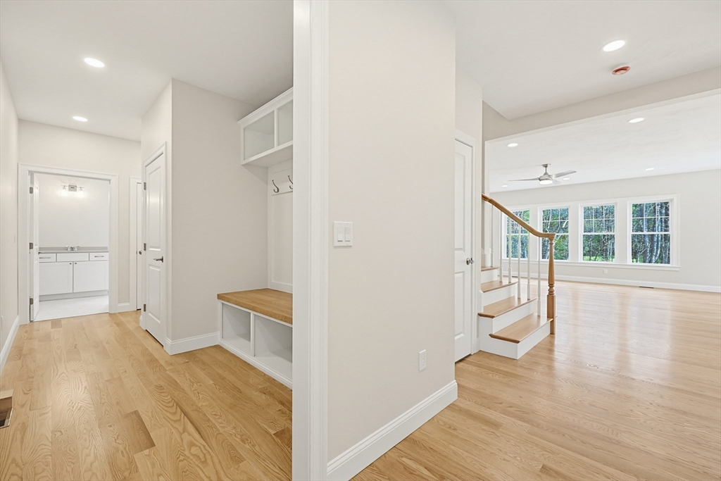 889 Maple Street Mansfield, MA 02048 - Photo 6 of 42 a bedroom with a bed and wooden floor
