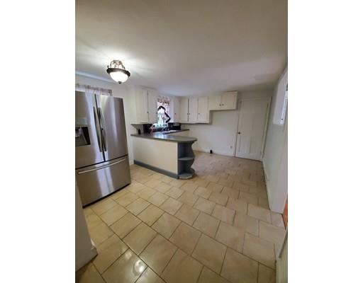 1570 Plumtree Road Springfield, MA 01119 - Photo 6 of 19 a kitchen with stainless steel appliances a refrigerator and a sink