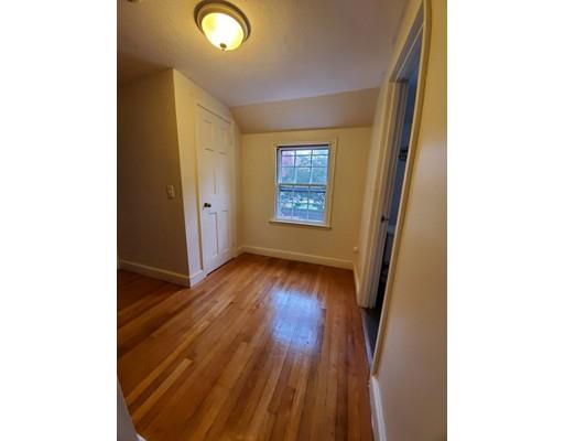 1570 Plumtree Road Springfield, MA 01119 - Photo 10 of 19 a view of an empty room with wooden floor and a window
