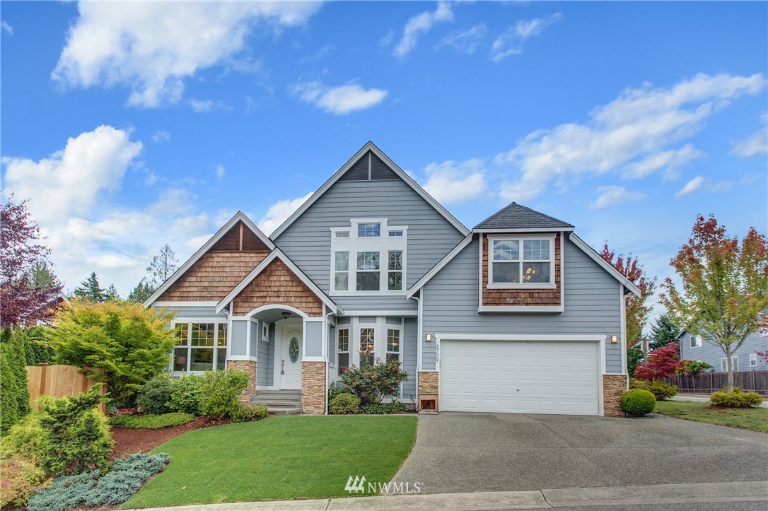 6709 Southeast 2nd Place Renton, WA 98059 - Photo 1 of 25 a front view of a house with garden