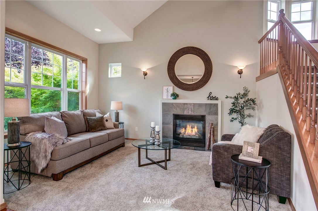 6709 Southeast 2nd Place Renton, WA 98059 - Photo 2 of 25 a living room with furniture and a fireplace