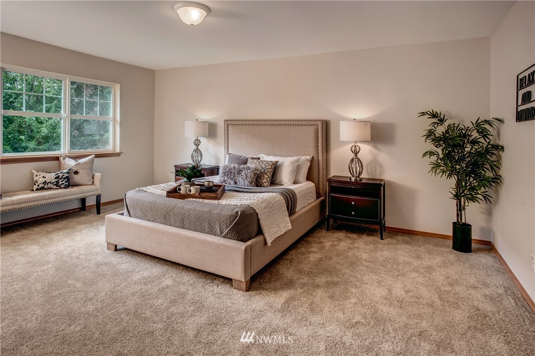 6709 Southeast 2nd Place Renton, WA 98059 - Photo 16 of 25 a bedroom with a bed and a couch