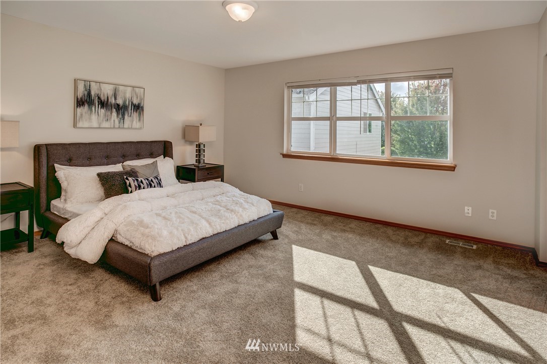 6709 Southeast 2nd Place Renton, WA 98059 - Photo 19 of 25 a bedroom with a bed and a window