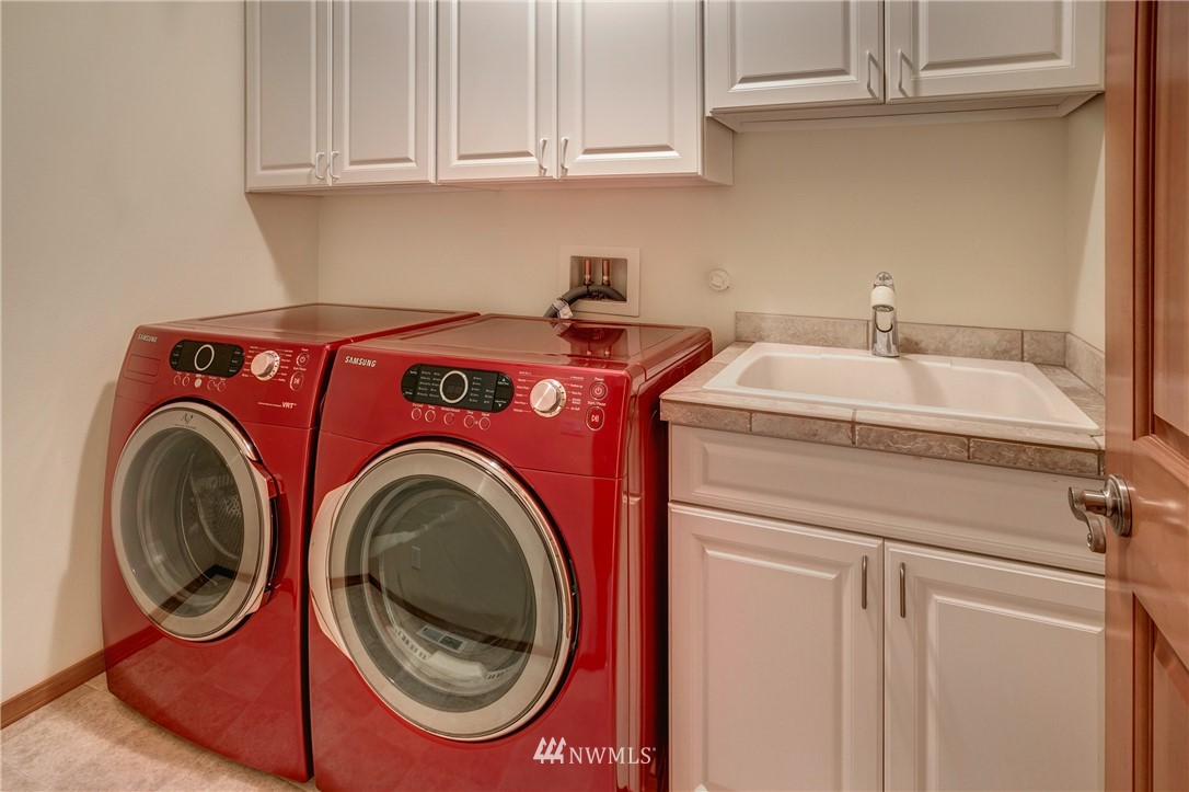 6709 Southeast 2nd Place Renton, WA 98059 - Photo 24 of 25 a utility room with dryer and washer