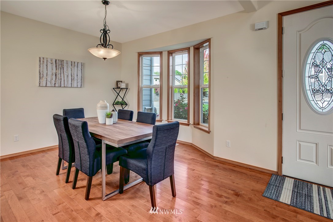 6709 Southeast 2nd Place Renton, WA 98059 - Photo 5 of 25 a view of a dining room with furniture window and wooden floor