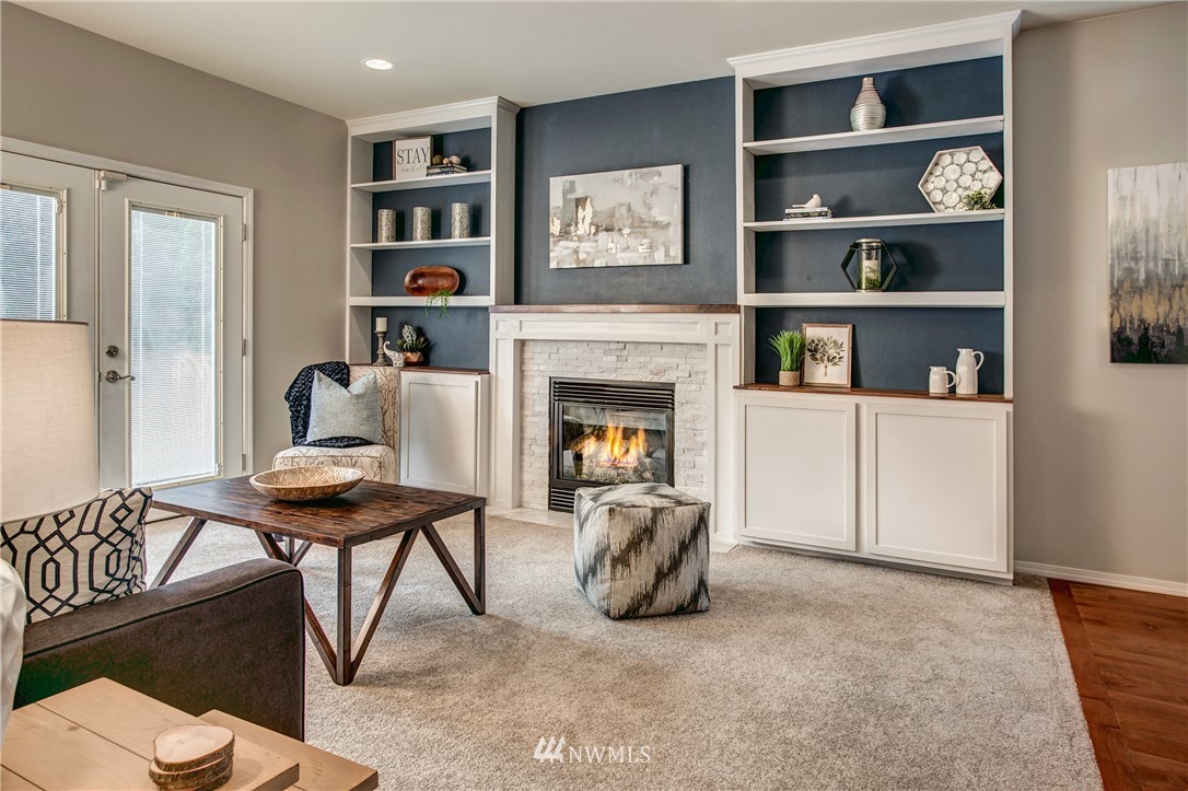 6709 Southeast 2nd Place Renton, WA 98059 - Photo 7 of 25 a living room with furniture and a fireplace