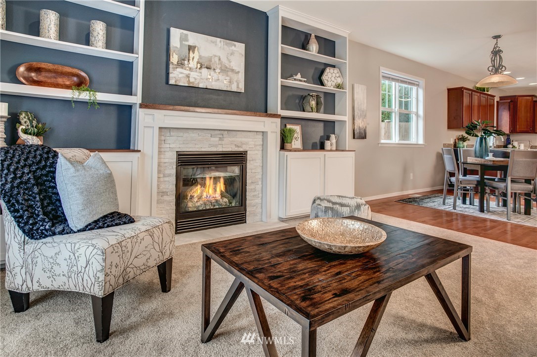 6709 Southeast 2nd Place Renton, WA 98059 - Photo 10 of 25 a living room with furniture and a fireplace