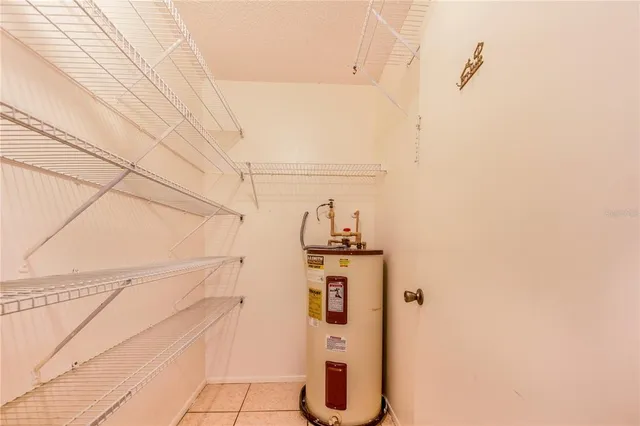 a view of a storage & utility room with racks on the wall
