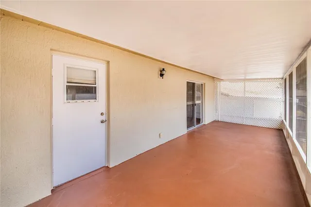 a view of empty room with windows