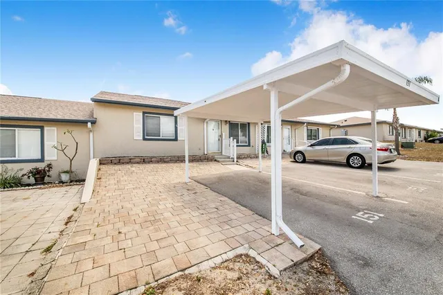 a view of a car parked in front of a house