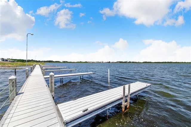 a view of a roof deck with two chair and a table