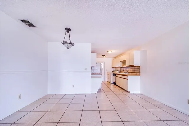 a kitchen with stainless steel appliances a sink and cabinets