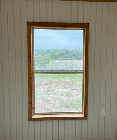 a view of a room that has a large window