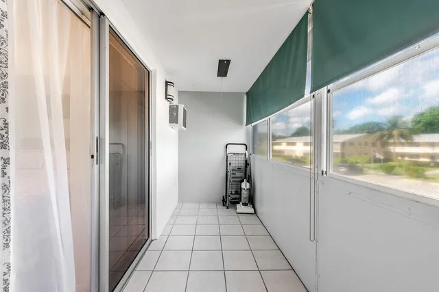 a view of a hallway with a window