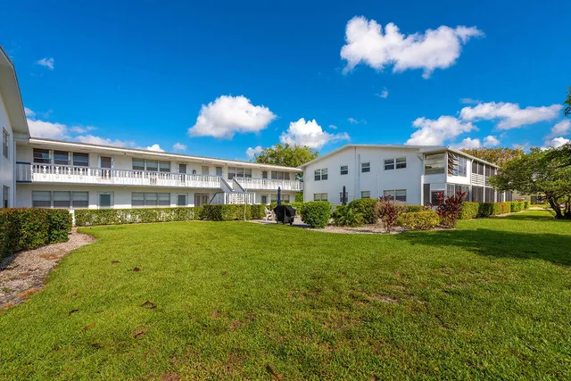 a view of a house with a big yard