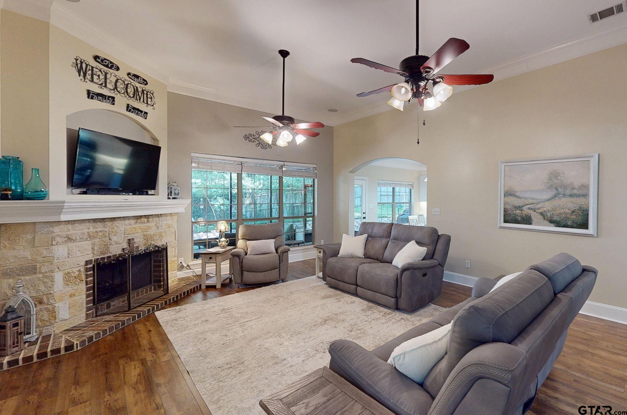 18488 Bluebird Circle Flint, TX 75762 - Photo 3 of 47 a living room with furniture fireplace and flat screen tv