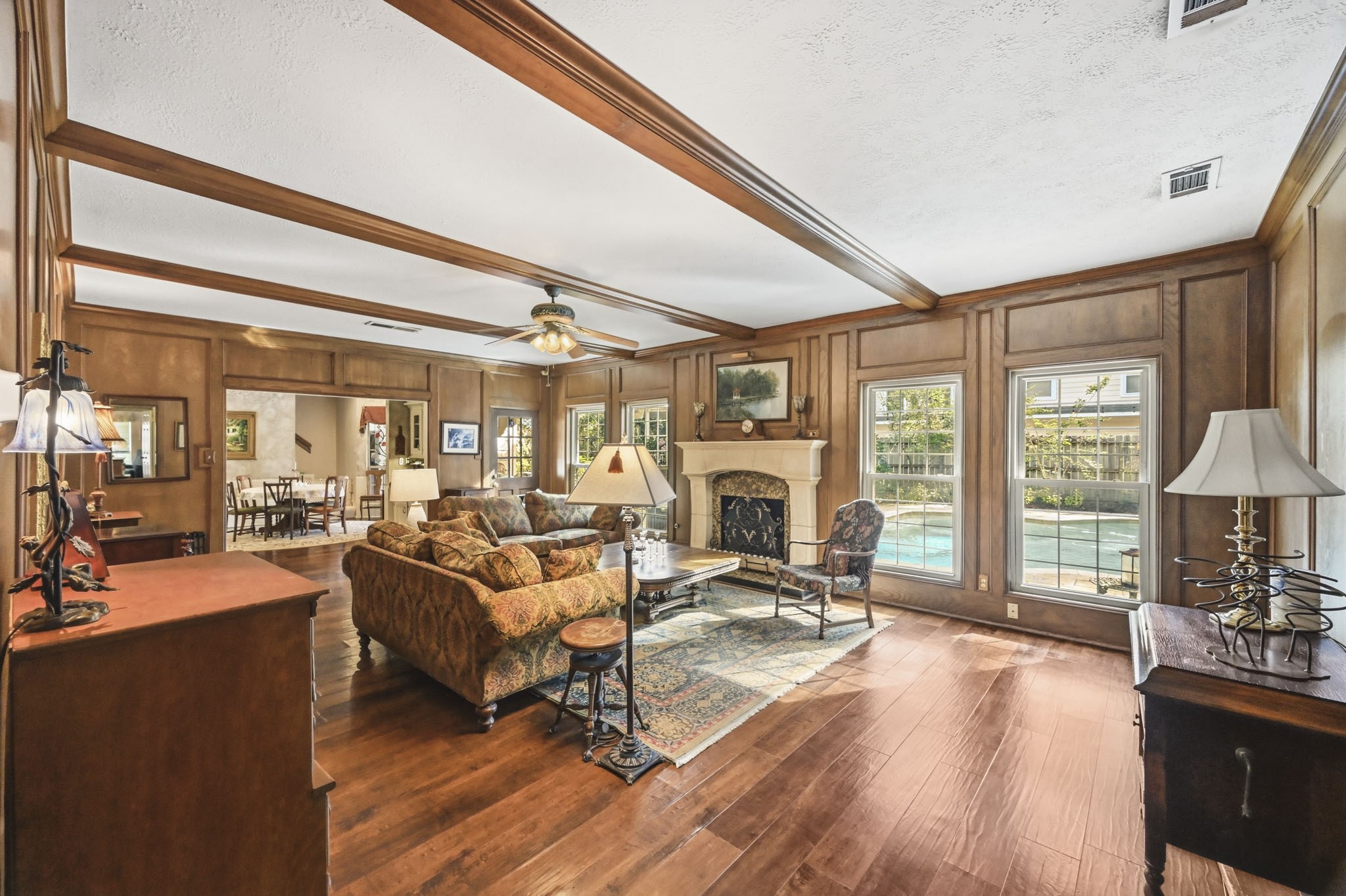 16030 Rudgewick Lane Spring, TX 77379 - Photo 11 of 50 The family room is just so roomy and can accommodate lots of furniture. With views of the backyard and pool, the room is light and bright. A beamed ceiling and a pressed stone mantel are handsome features.