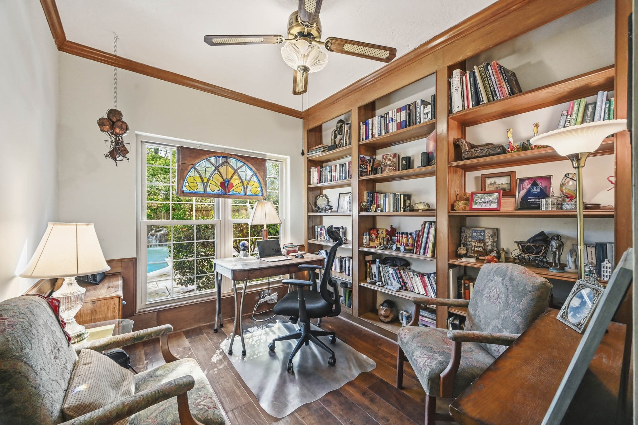 16030 Rudgewick Lane Spring, TX 77379 - Photo 20 of 50 This cute office has pool views and wall of shelving.