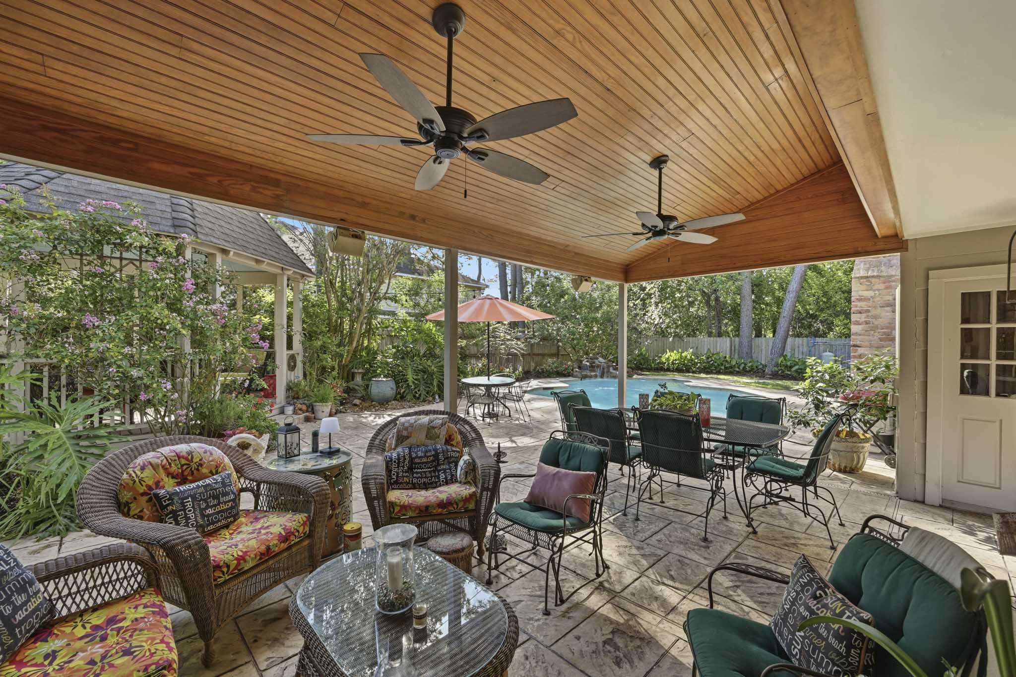 16030 Rudgewick Lane Spring, TX 77379 - Photo 2 of 50 Do you like to entertain? Or have your large family in for holidays? The winter months are the best time outside and this yard has so much covered seating with this porch and a gazebo where you can enjoy the flowers and mature landscaping.