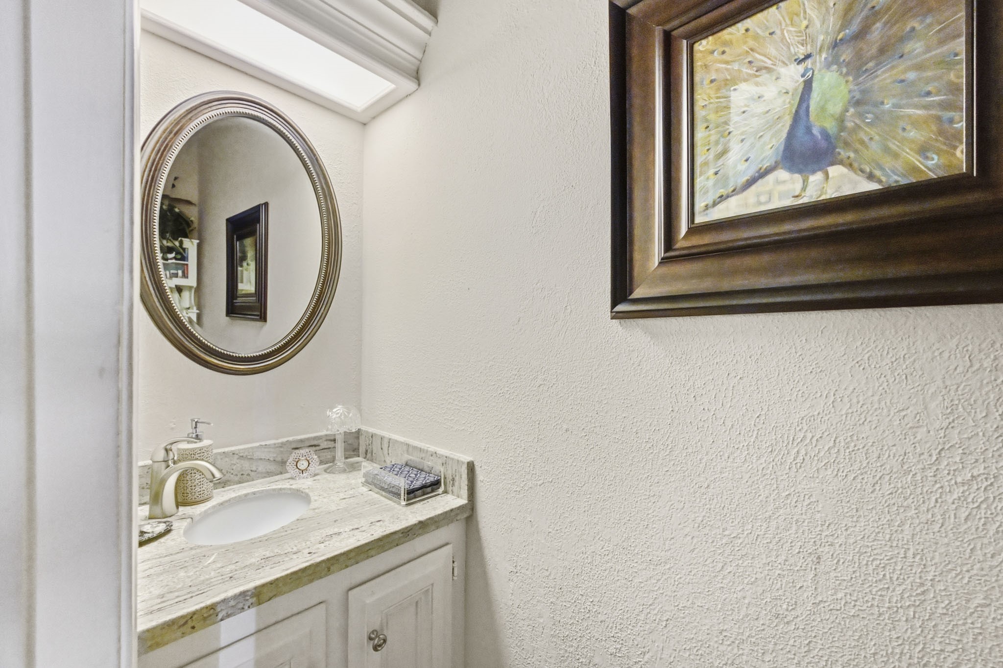16030 Rudgewick Lane Spring, TX 77379 - Photo 22 of 50 This powder room is down the hall from the family room and features a granite counter and cute sink set on the diagonal. This room was redone in 2019 with counters, sink, vent installed.
