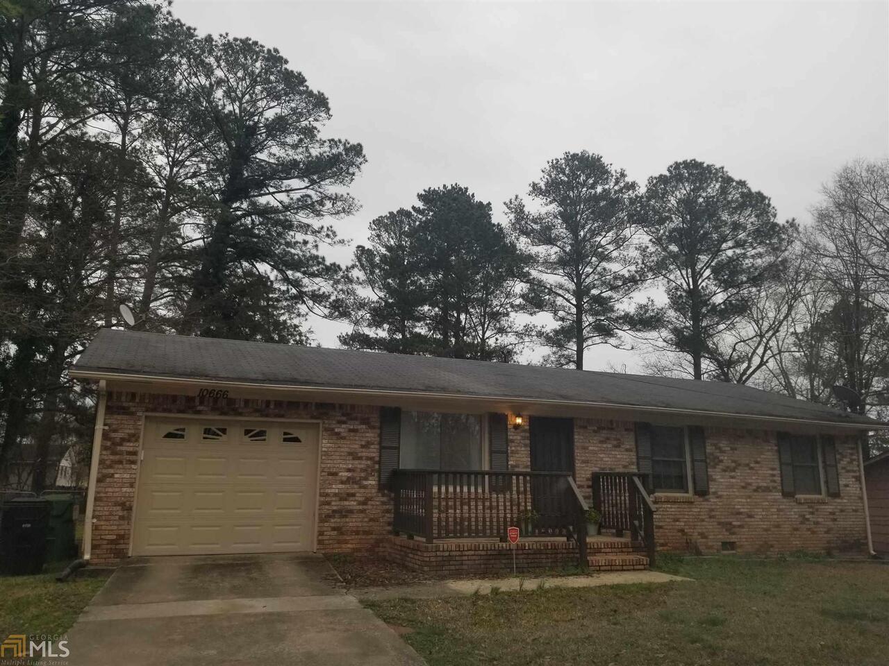 10666 Panhandle Road Hampton, GA 30228 - Photo 1 of 1 a front view of a house with garage