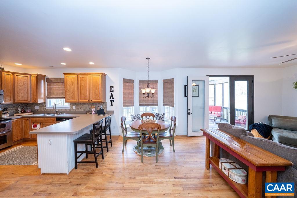 60 Pine Ridge Road Faber, VA 22938 - Photo 17 of 74 a large kitchen with lots of counter space dining table and chairs