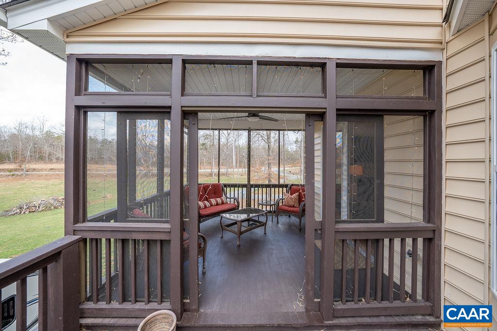 60 Pine Ridge Road Faber, VA 22938 - Photo 24 of 74 a view of a balcony with couch and wooden floor